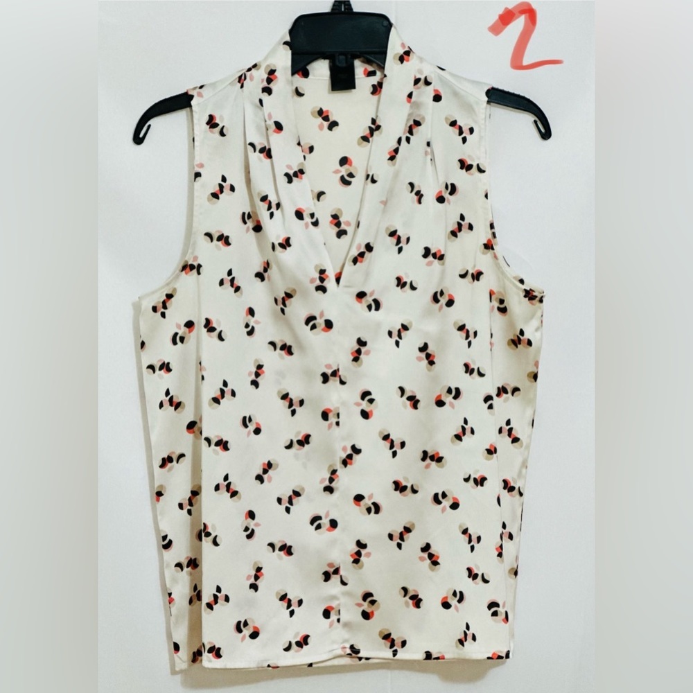 LADIES WHITE SLEEVELESS TOP WITH BLACK, TAN & PINK DESIGNS